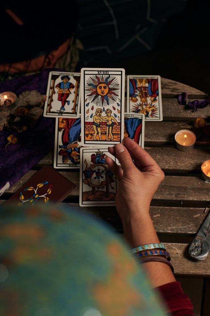 Close-up of a fortune teller reading tarot cards